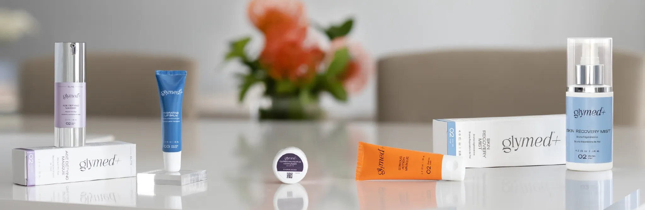 Various skincare products including bottles, tubes, and boxes are neatly displayed on a surface.