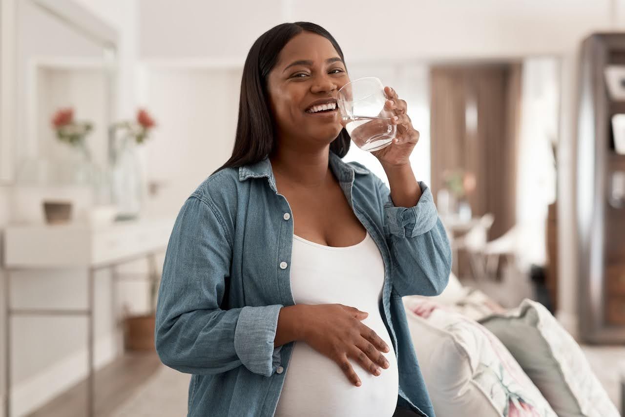 Pregnant woman drinking water