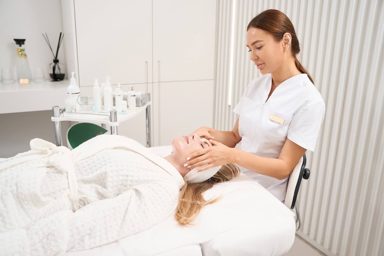 Skincare professional giving treatment
