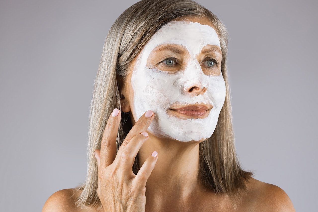 Woman applying exfoliating masque.jpg