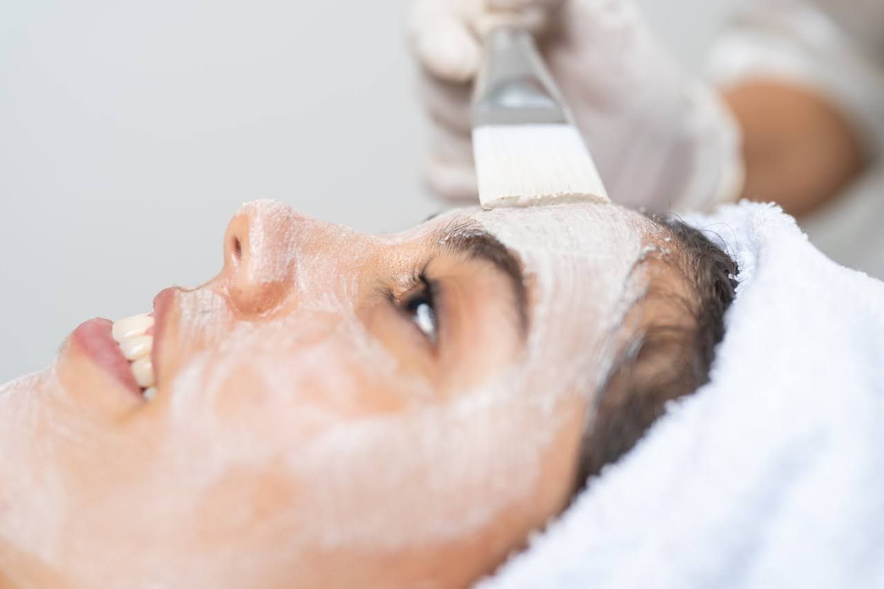 Woman getting chemical peel to help even skin tone