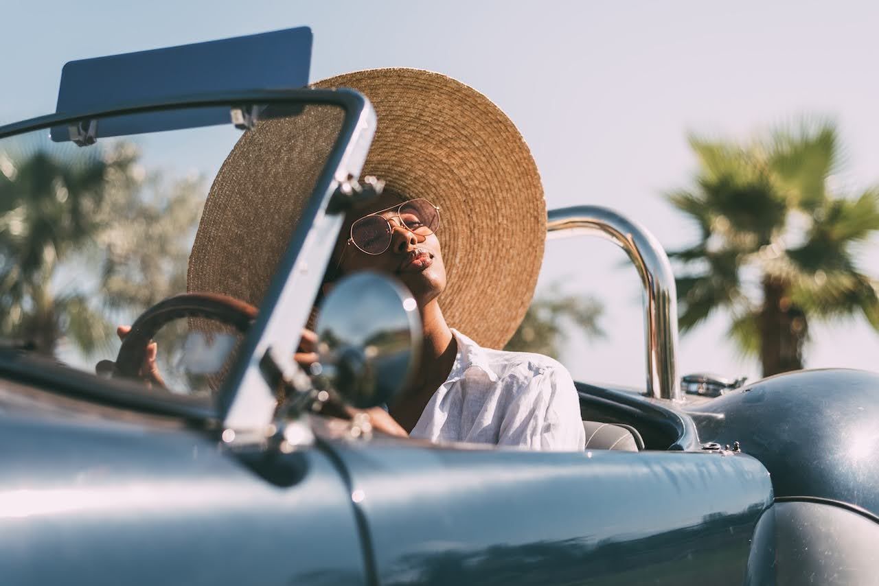 Woman wearing protective clothing and accessories to protect from sun damage