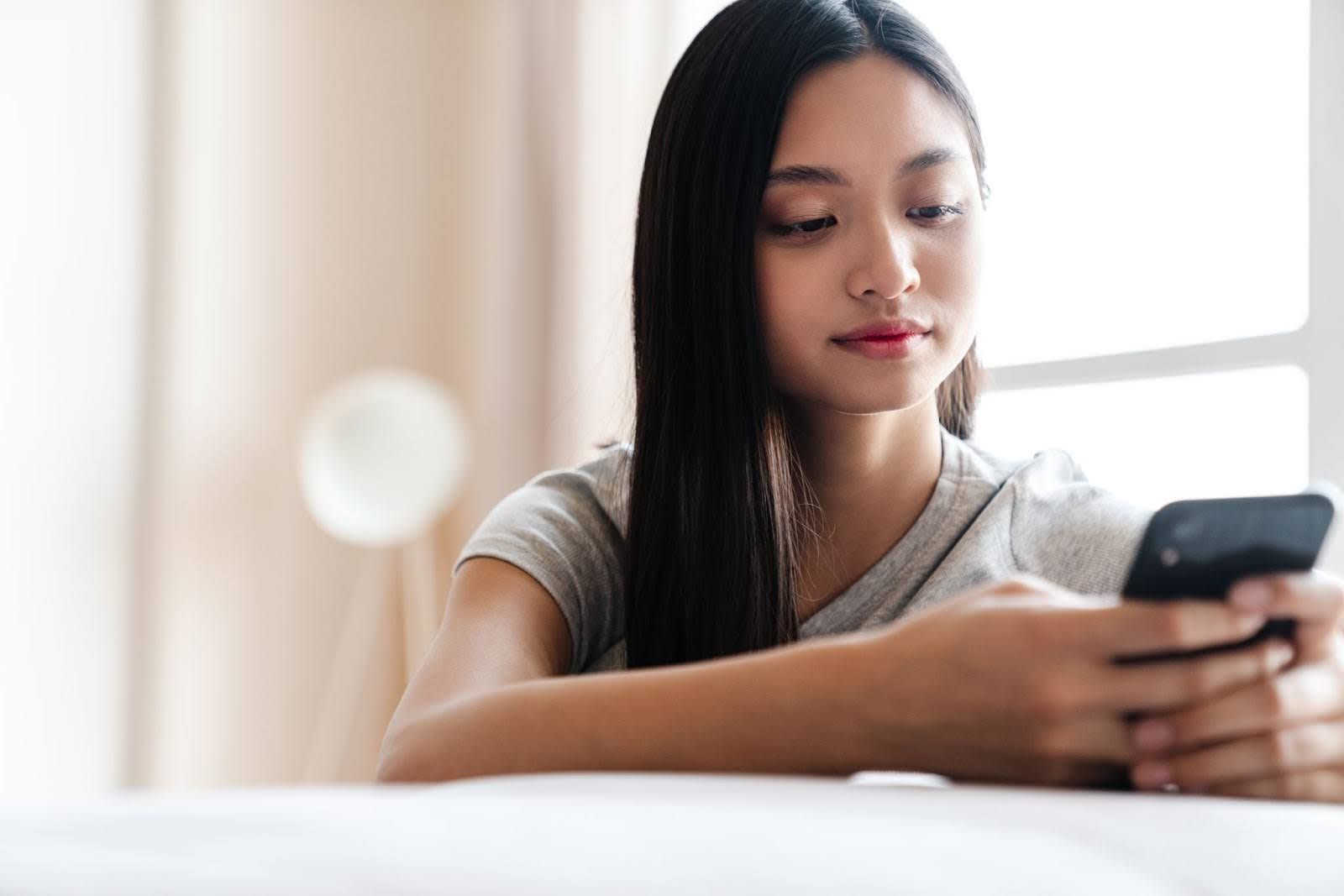 Young girl looking up skincare for teens online