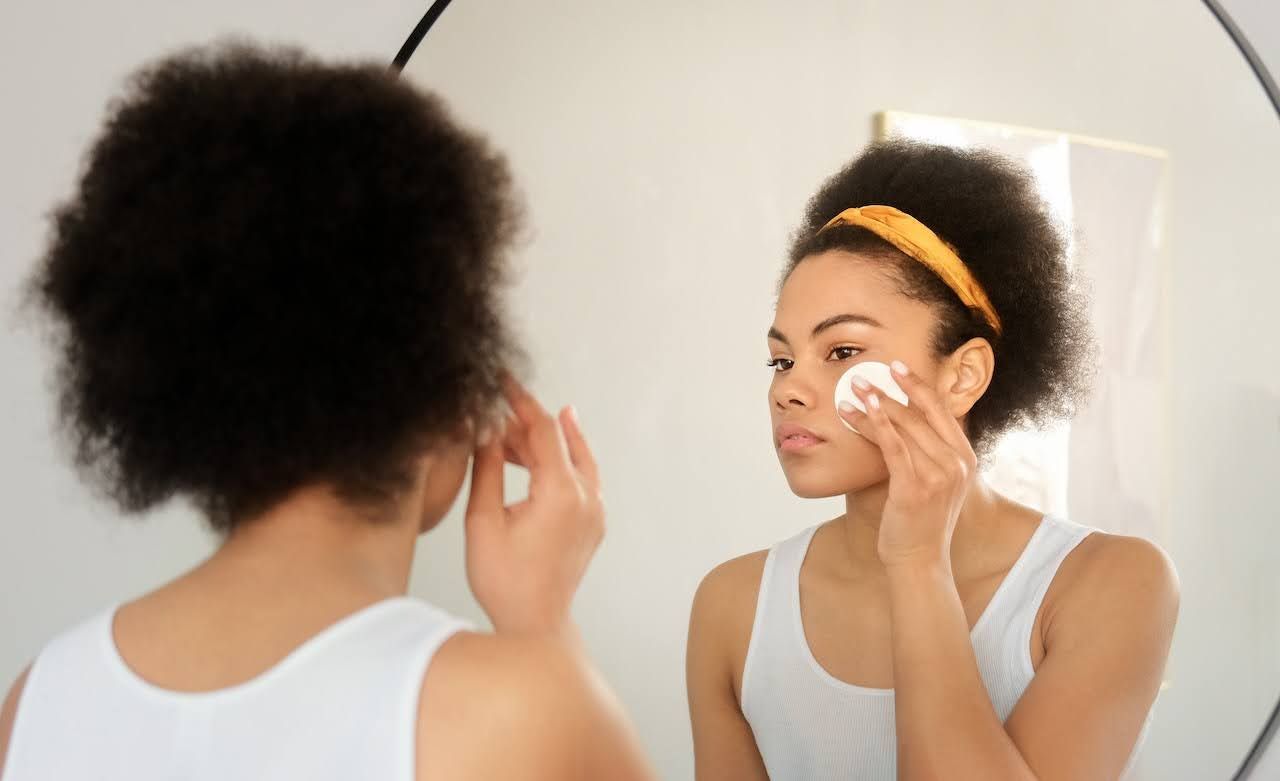Young woman using skincare routine for teens