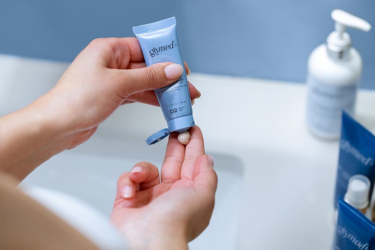 applying GlyMed+ skincare product for dehydrated skin