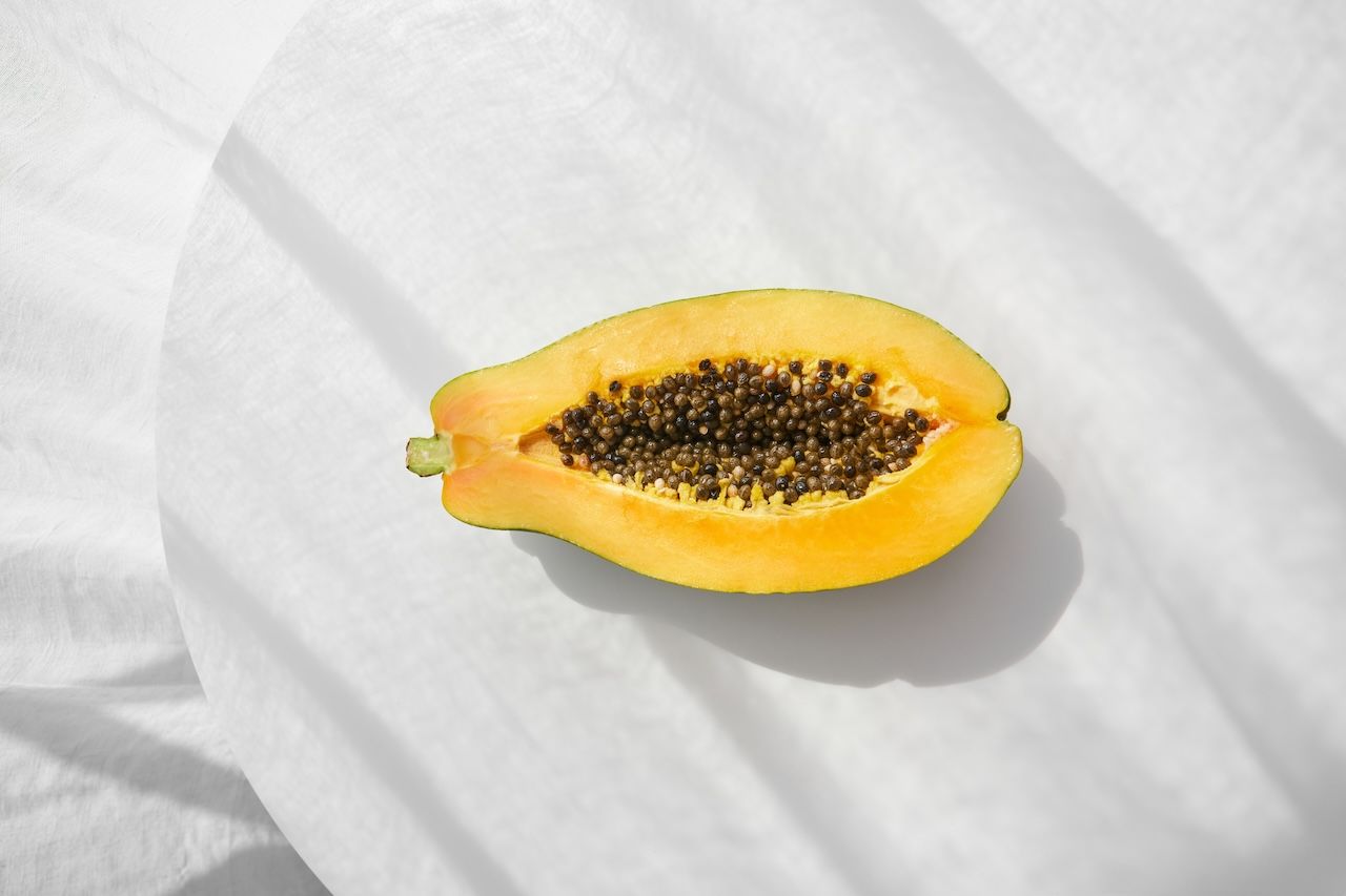 fresh papaya fruit on white background 
