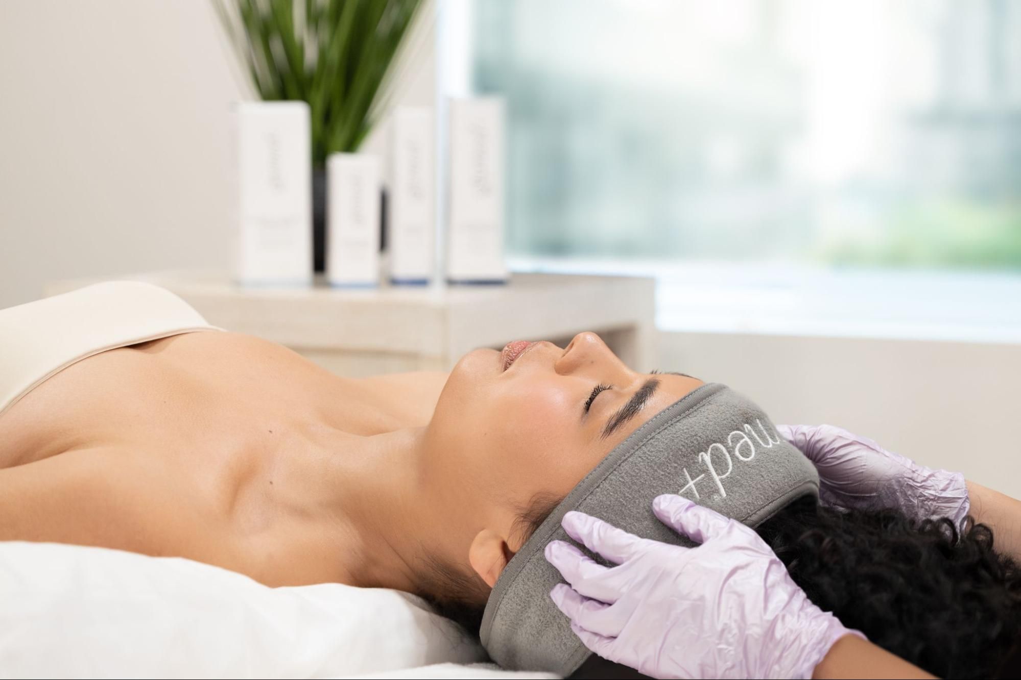 client preparing for a professional skincare treatment with glymed+