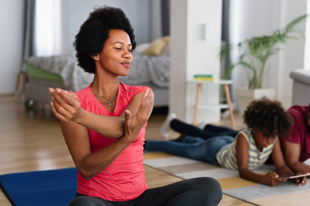 woman doing yoga to destress